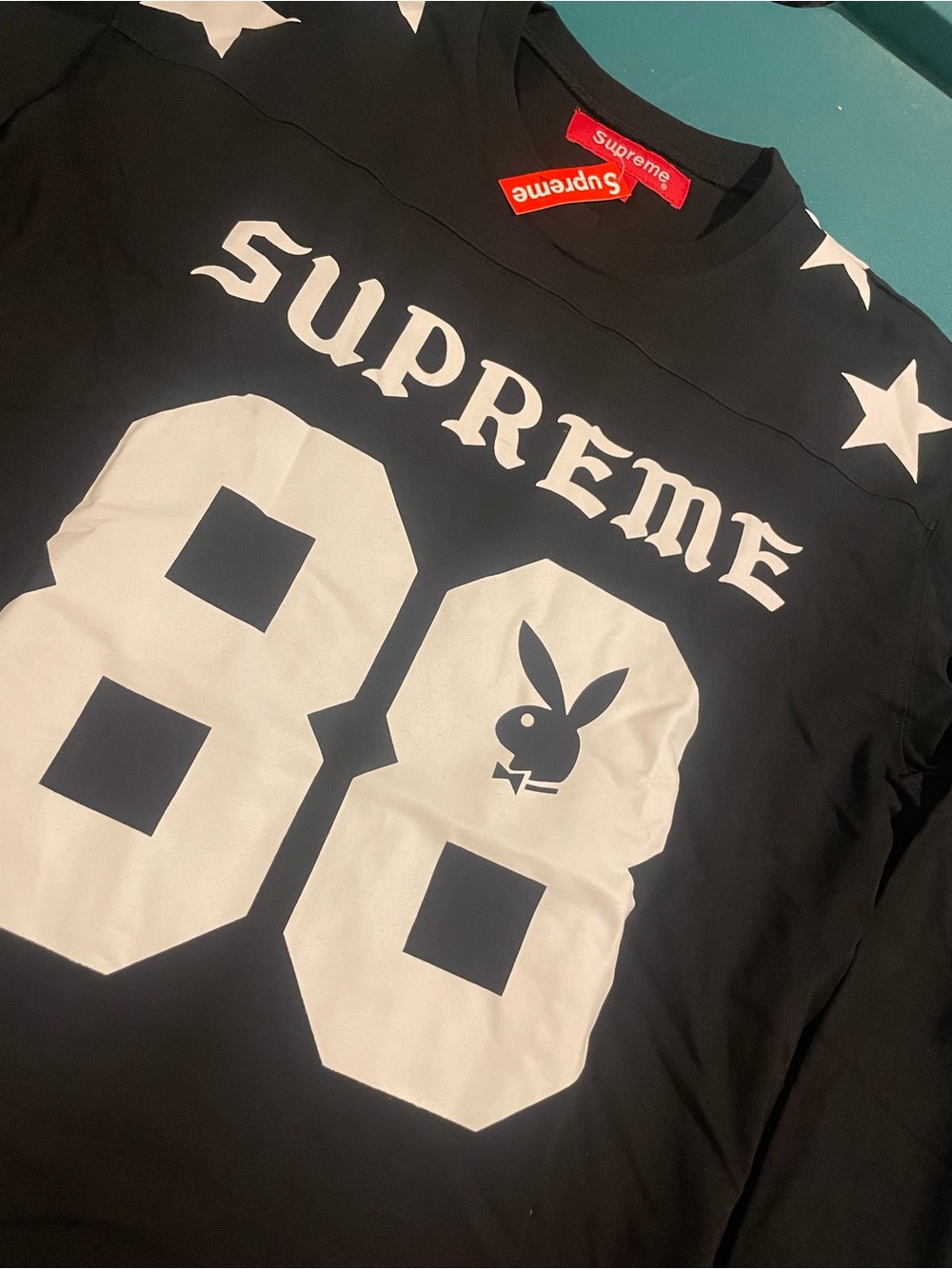 Supreme Black Long Sleeve Graphic Jersey Top with White Print